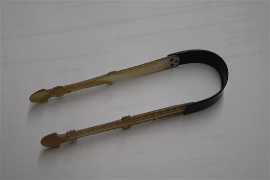 A pair of George III mother of pearl and tortoiseshell sugar tongs